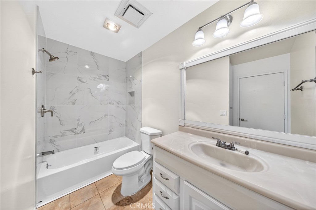 3054 Associated, Unit 26 Fullerton, CA 92835 - Photo 12 of 27 a bathroom with a sink a toilet and a bathtub