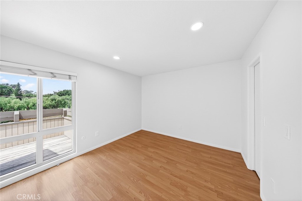 3054 Associated, Unit 26 Fullerton, CA 92835 - Photo 14 of 27 a view of empty room with wooden floor