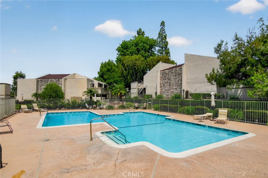 3054 Associated, Unit 26 Fullerton, CA 92835 - Photo 20 of 27 a view of a house with swimming pool