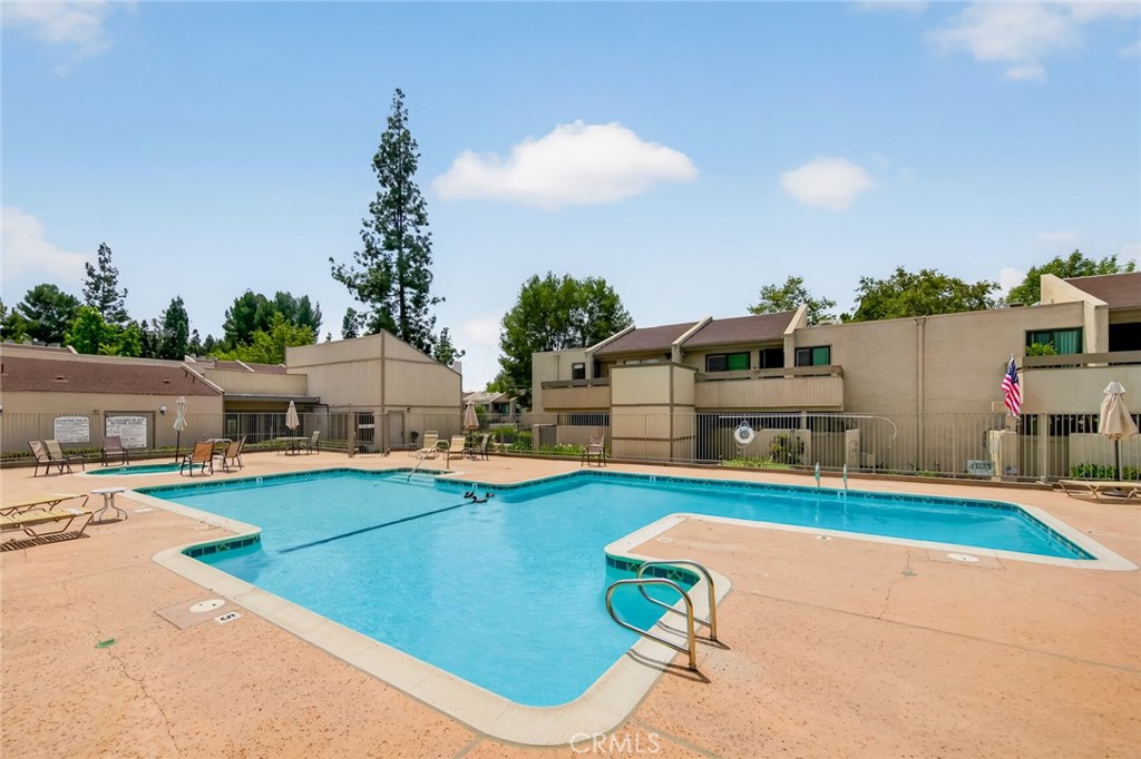 3054 Associated, Unit 26 Fullerton, CA 92835 - Photo 21 of 27 a view of a house with swimming pool and furniture