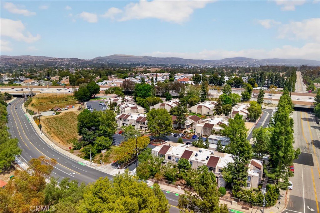 3054 Associated, Unit 26 Fullerton, CA 92835 - Photo 25 of 27 an aerial view of residential houses with outdoor space
