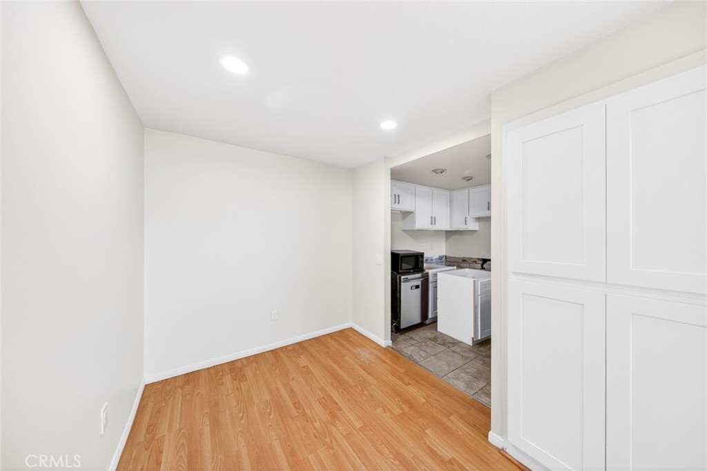 3054 Associated, Unit 26 Fullerton, CA 92835 - Photo 8 of 27 a kitchen with a refrigerator and a stove top oven