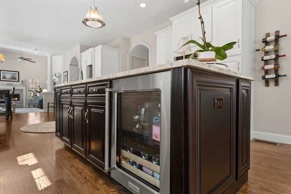 a bedroom with a bed and a mirror on dresser