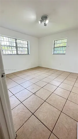a view of an empty room and window