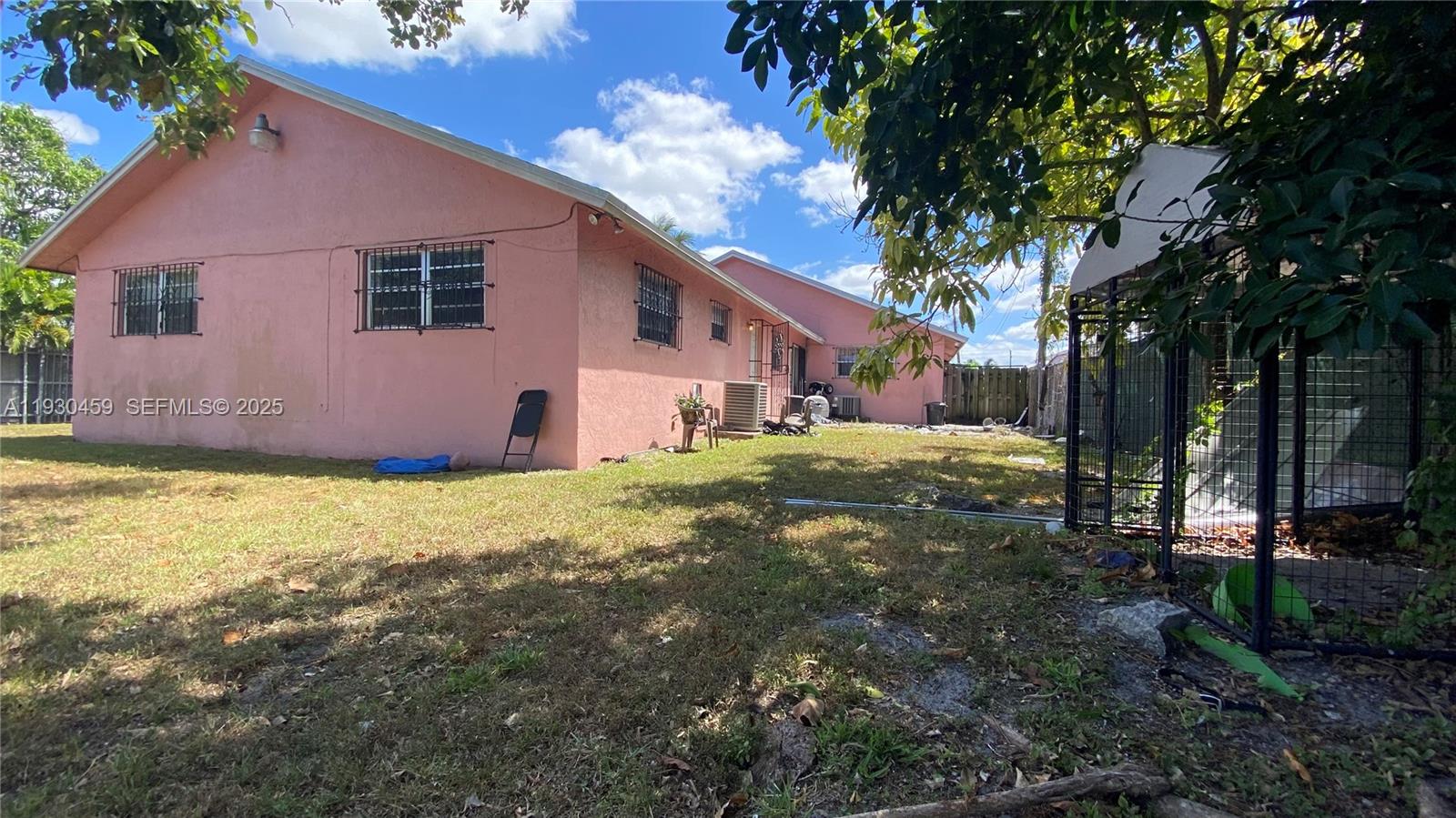 2175 Northwest 104th Street, Unit 2 Miami, FL 33147 - Photo 13 of 13 a view of a house with a yard