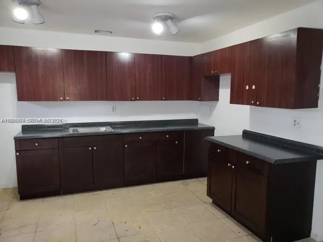 a kitchen with a cabinets and a sink