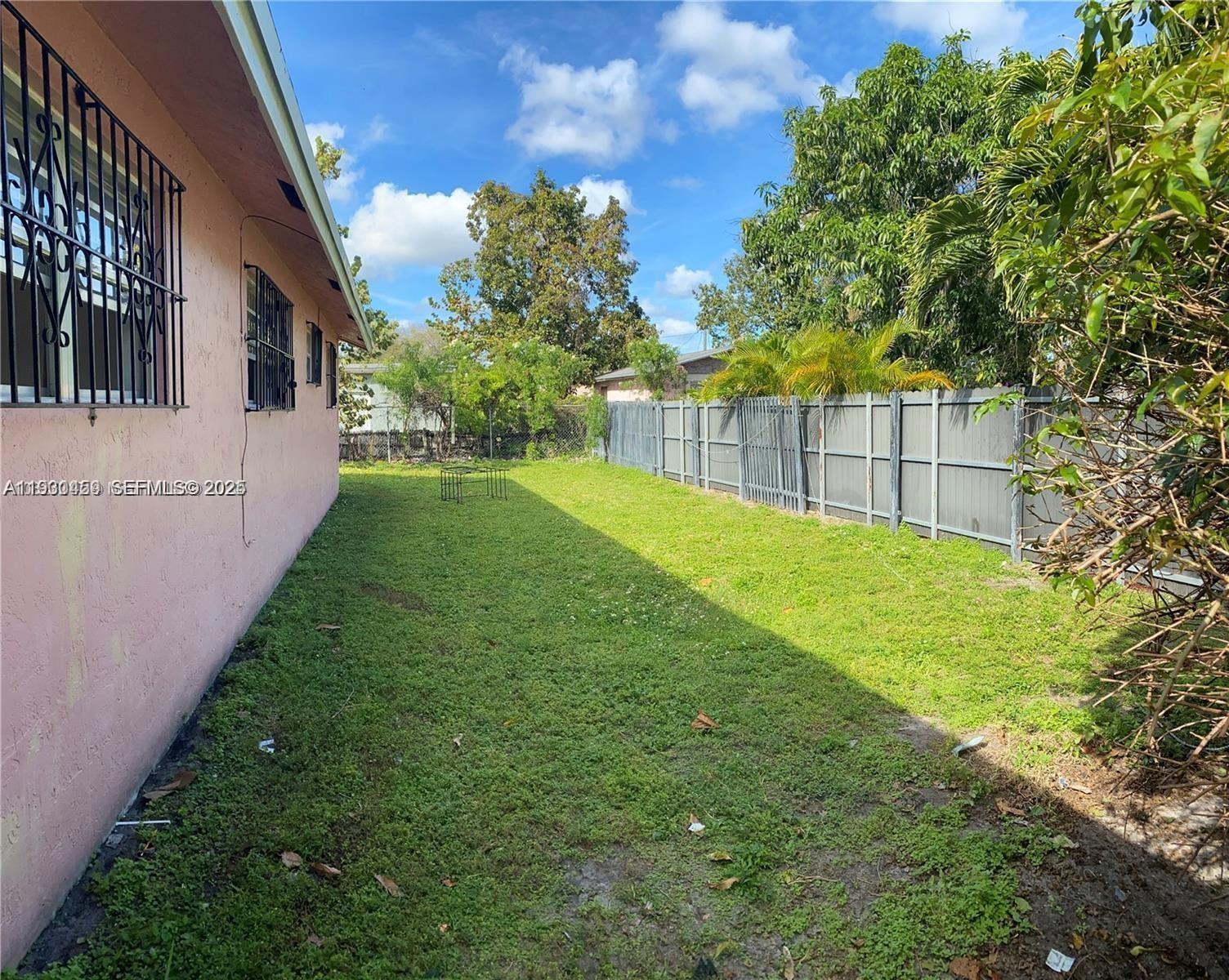 2175 Northwest 104th Street, Unit 2 Miami, FL 33147 - Photo 5 of 13 a view of yard with small cabin
