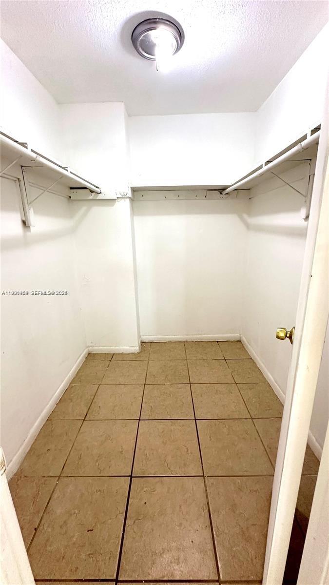 2175 Northwest 104th Street, Unit 2 Miami, FL 33147 - Photo 9 of 13 a view of an empty room