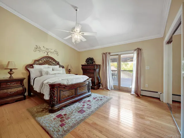 a bed room with a bed and a chandelier