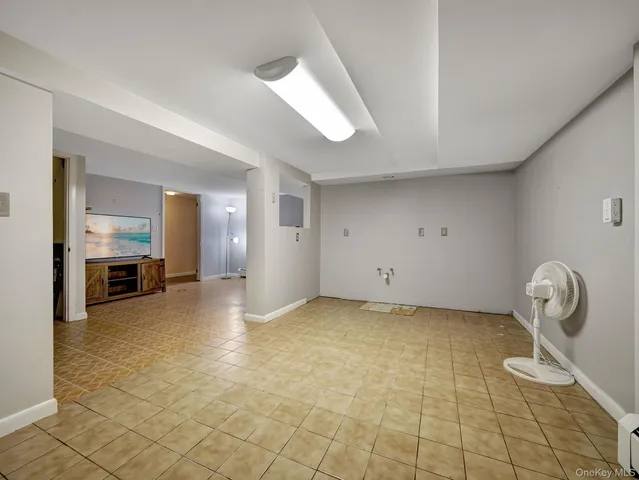 an empty room with a empty space and windows