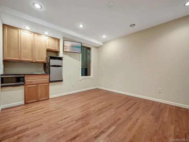 a hallway with a table and a couch