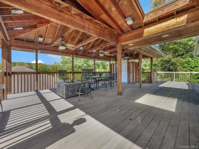 a white sink sitting under a bathroom mirror