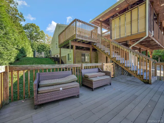 a view of backyard with sitting area
