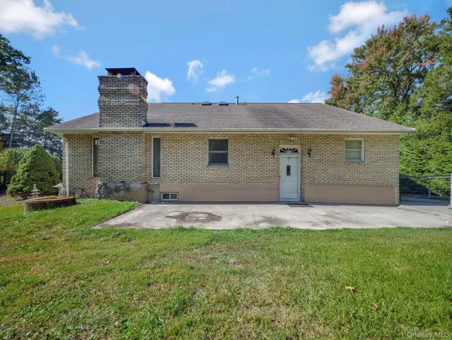 a front view of a house with a garden and garage