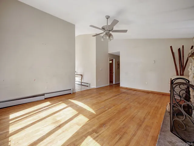 a view of a fireplace with wooden floor