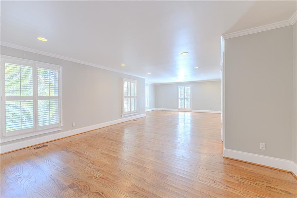 7680 Jett Ferry Road Atlanta, GA 30350 - Photo 14 of 74 wooden floor in an empty room with a window
