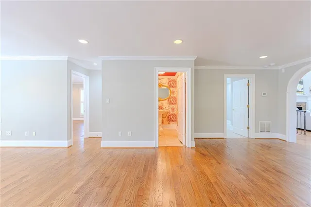 a bathroom with a granite countertop toilet and a sink