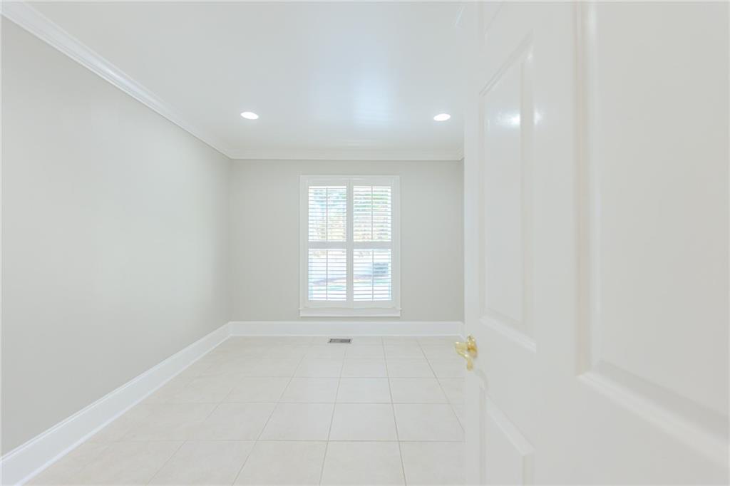 7680 Jett Ferry Road Atlanta, GA 30350 - Photo 16 of 74 a view of an empty room with a window