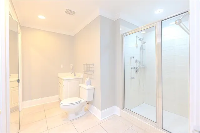 a spacious bedroom with a large bed and a couch