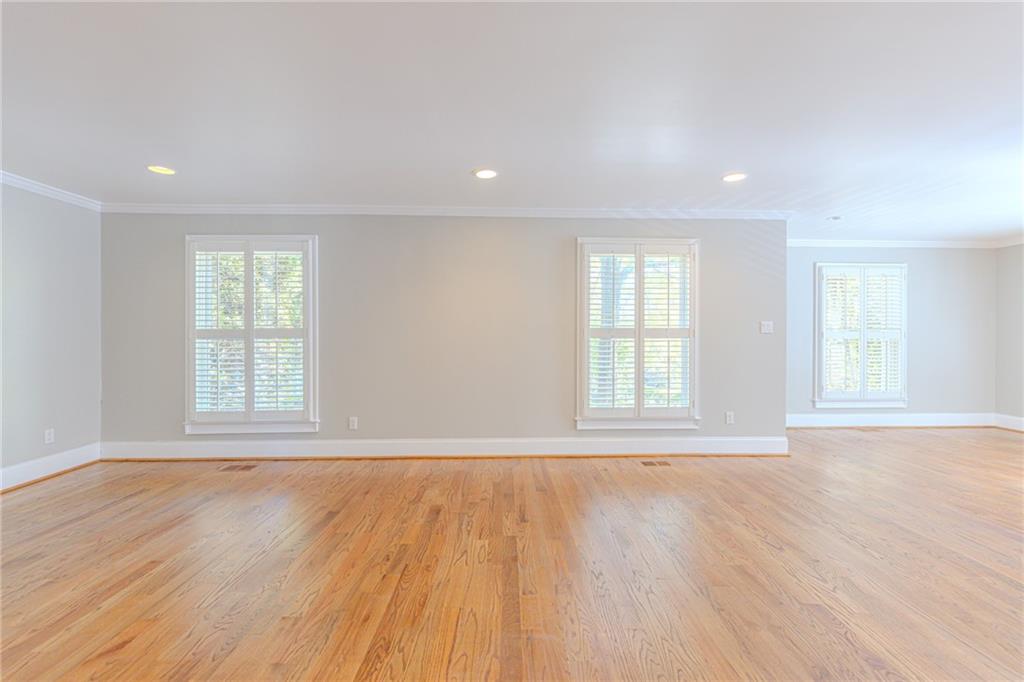 7680 Jett Ferry Road Atlanta, GA 30350 - Photo 23 of 74 an empty room with wooden floor and windows