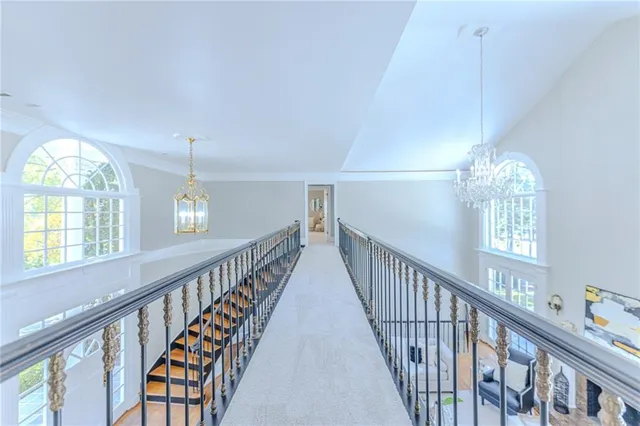 a spacious bathroom with a granite countertop sink and a mirror