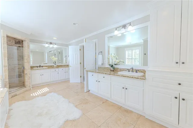 an empty room with windows and entrance to other room