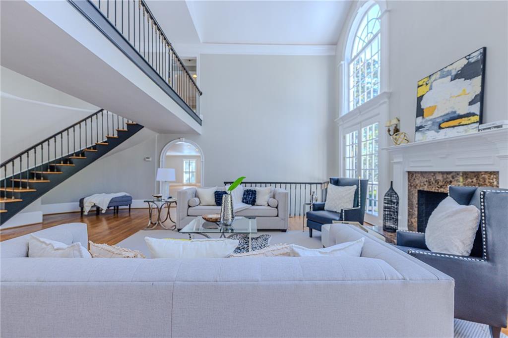 7680 Jett Ferry Road Atlanta, GA 30350 - Photo 54 of 74 a living room with furniture and a fireplace