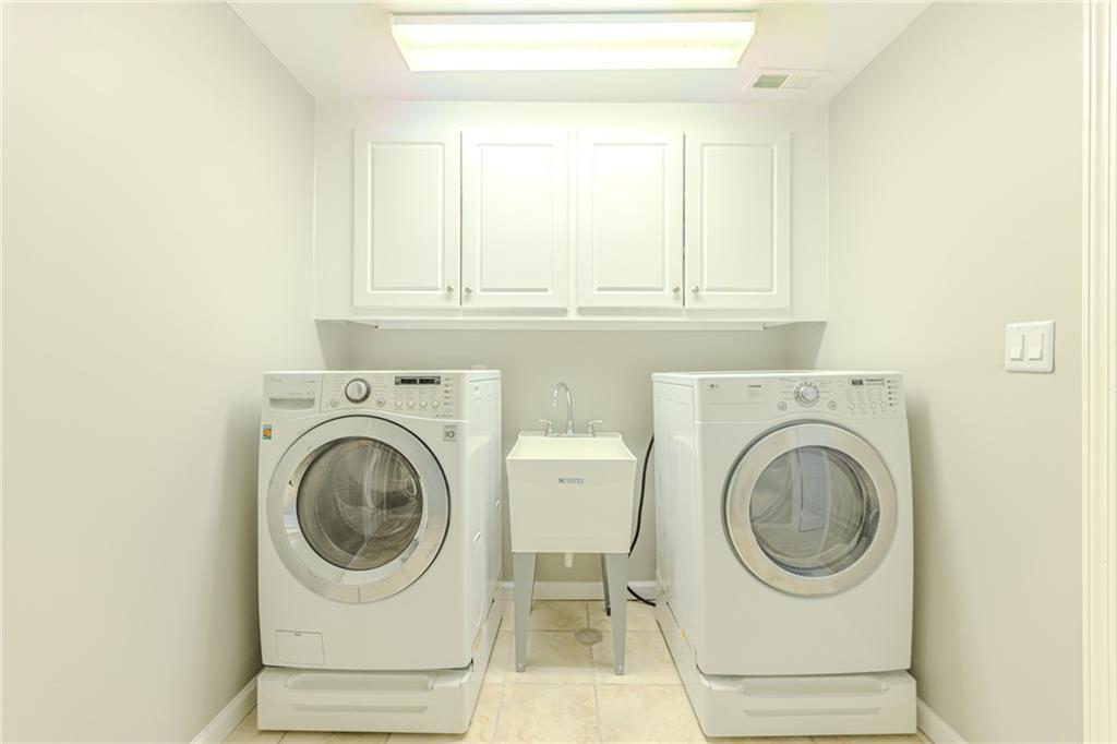 7680 Jett Ferry Road Atlanta, GA 30350 - Photo 57 of 74 a utility room with dryer and washer