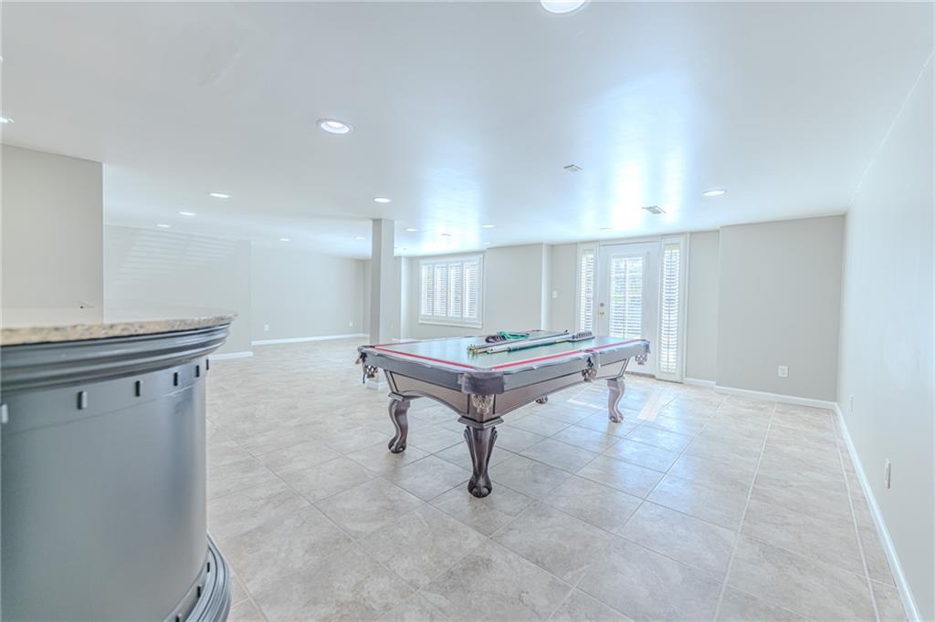 7680 Jett Ferry Road Atlanta, GA 30350 - Photo 58 of 74 a living room with furniture and a table