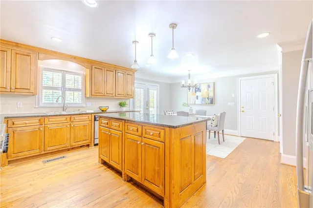 a dining room with furniture and chandelier