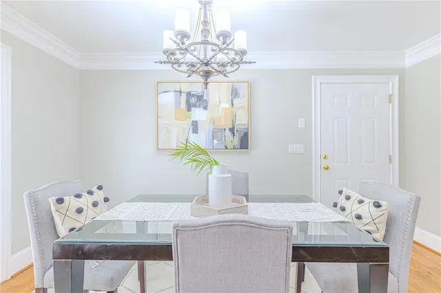 a kitchen with stainless steel appliances granite countertop a refrigerator a stove top oven and a sink