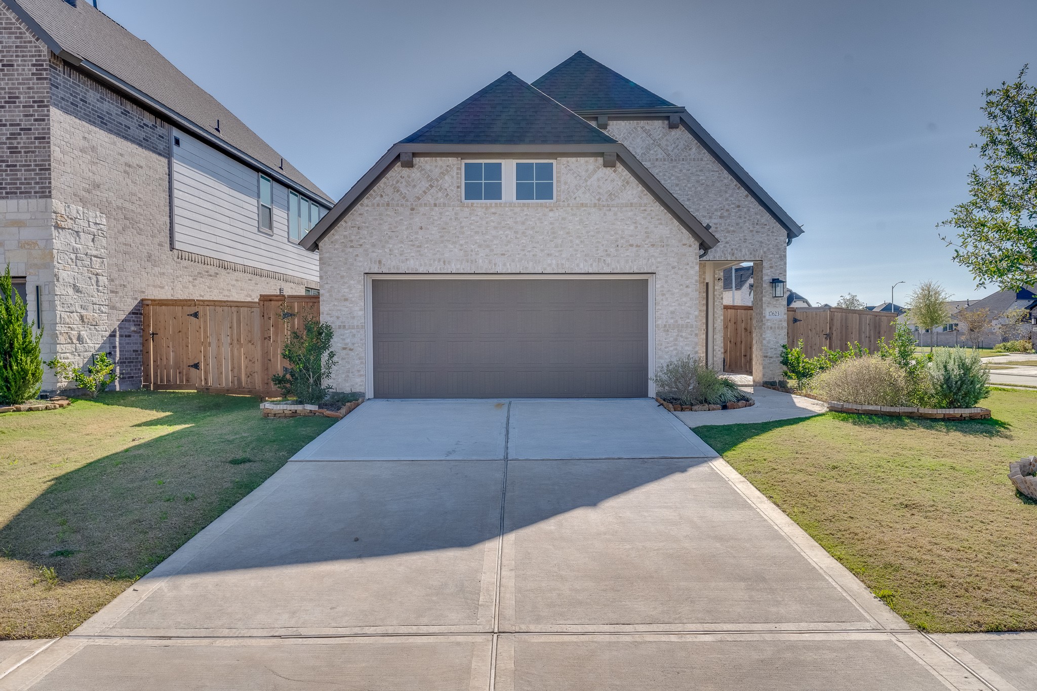 17623 Azalea Clf Court Richmond, TX 77407 - Photo 1 of 33 a front view of house with a yard and garage