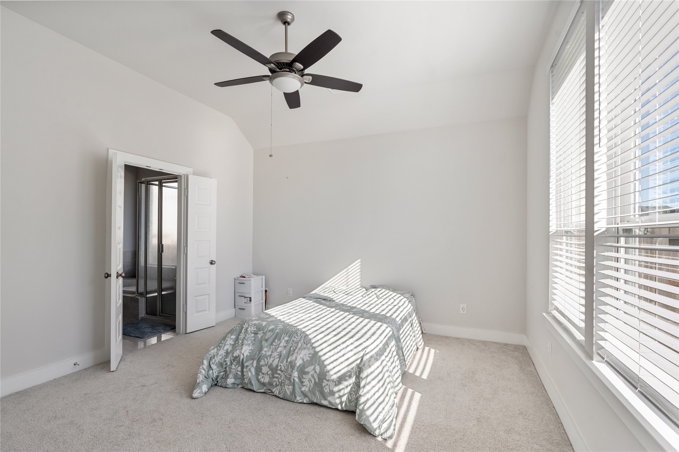 17623 Azalea Clf Court Richmond, TX 77407 - Photo 19 of 33 a bedroom with a bed and a large window