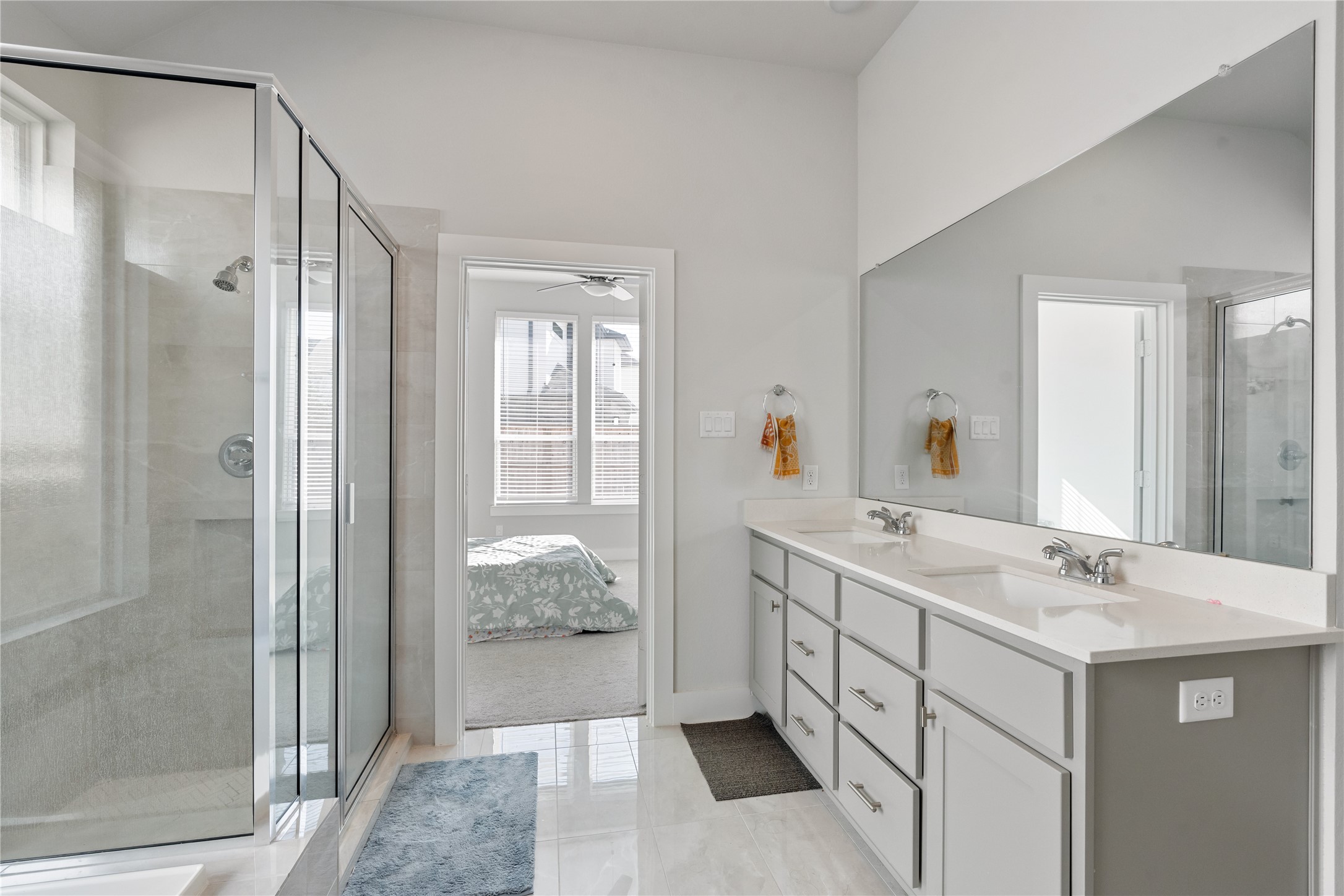 17623 Azalea Clf Court Richmond, TX 77407 - Photo 20 of 33 a bathroom with a double vanity sink mirror and shower