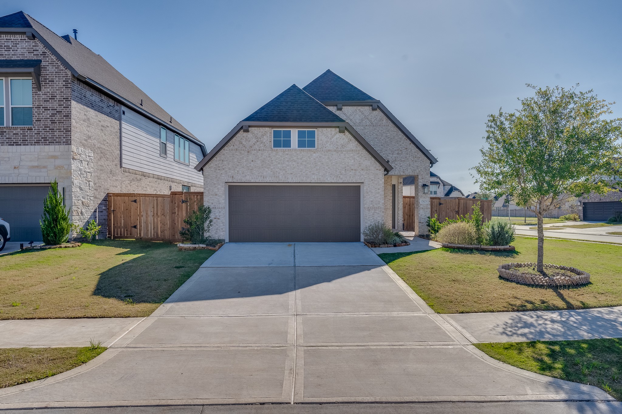 17623 Azalea Clf Court Richmond, TX 77407 - Photo 2 of 33 a front view of a house with a yard and garage