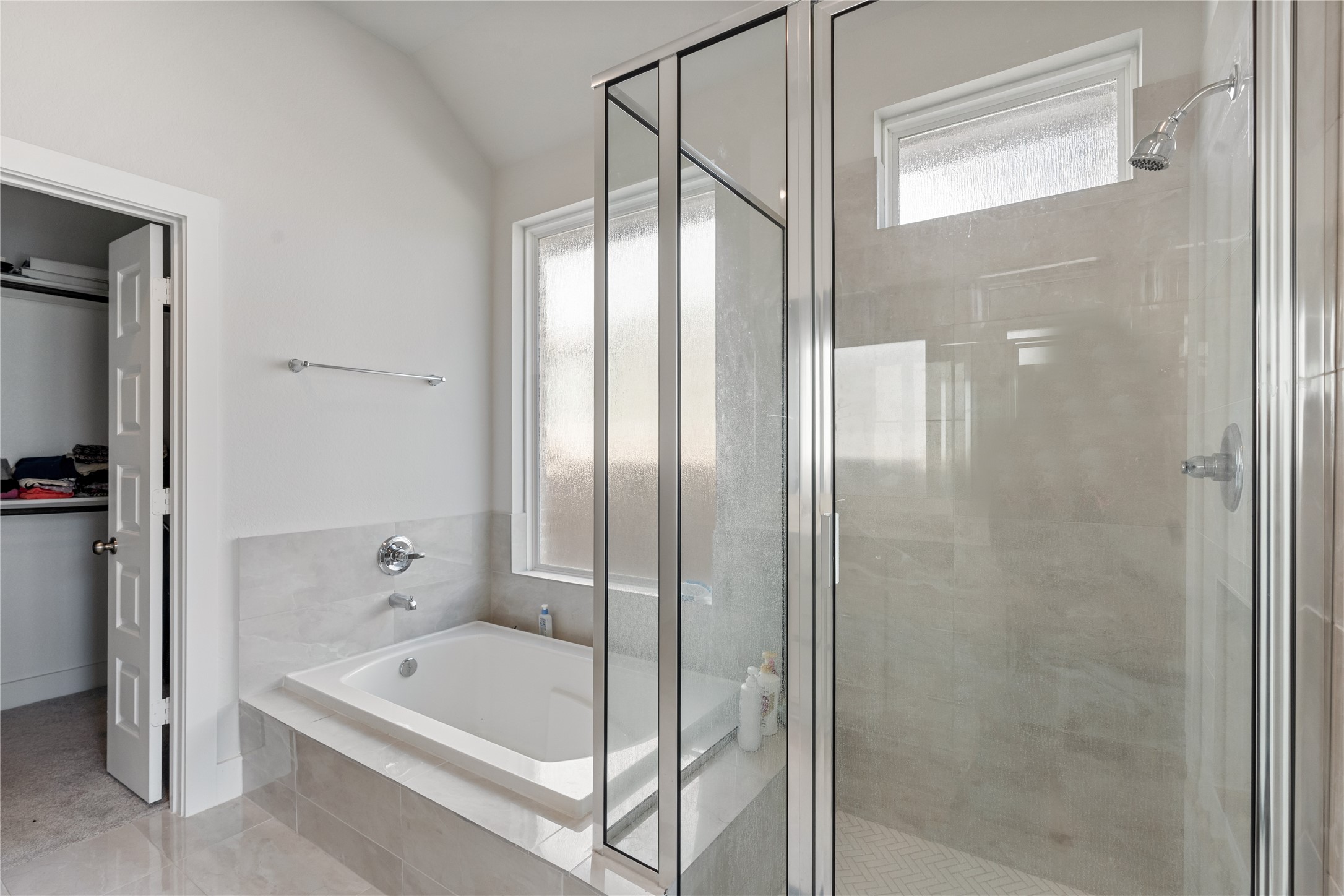 17623 Azalea Clf Court Richmond, TX 77407 - Photo 23 of 33 a bathroom with a bathtub and a shower