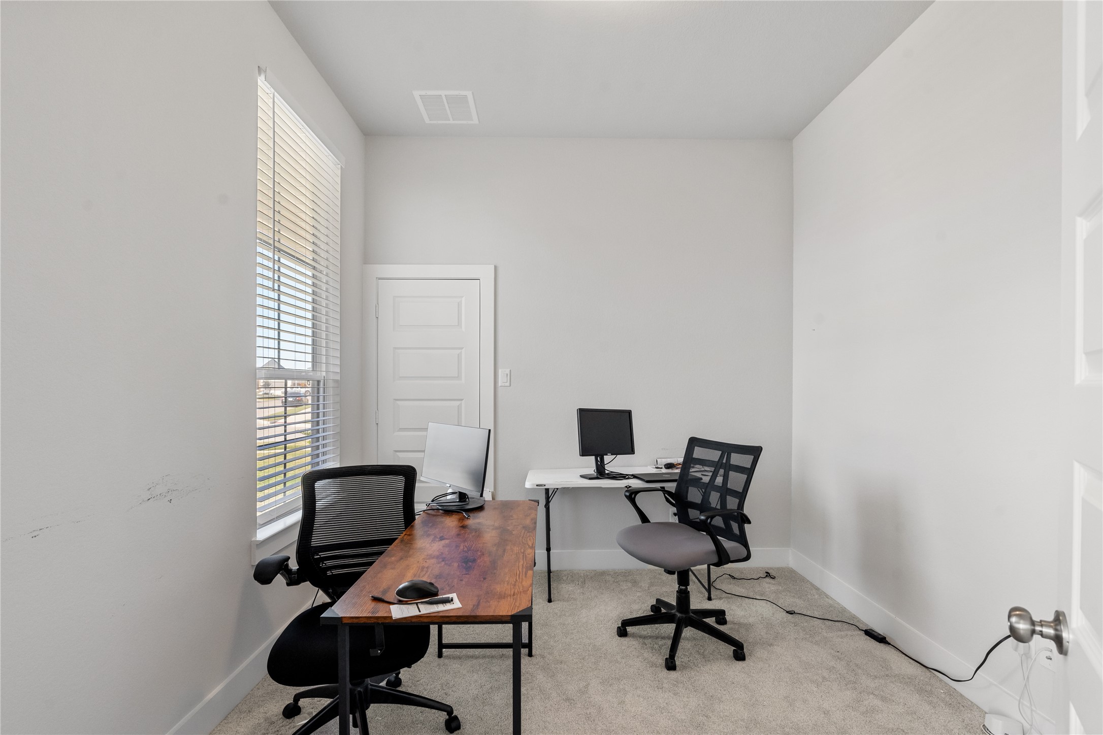 17623 Azalea Clf Court Richmond, TX 77407 - Photo 24 of 33 a view of a workspace with furniture and a window