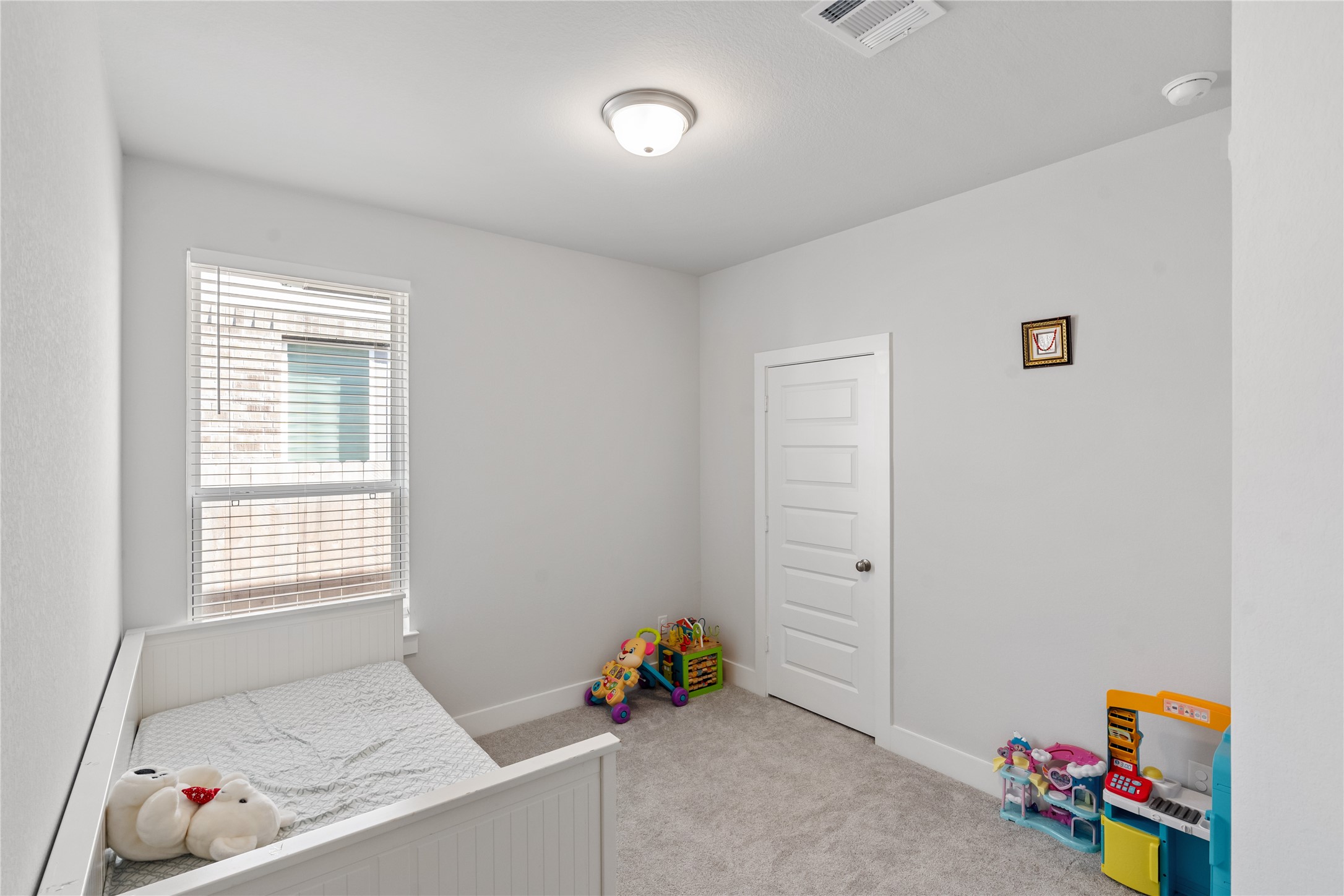 17623 Azalea Clf Court Richmond, TX 77407 - Photo 27 of 33 a hallway with toys and wooden floor