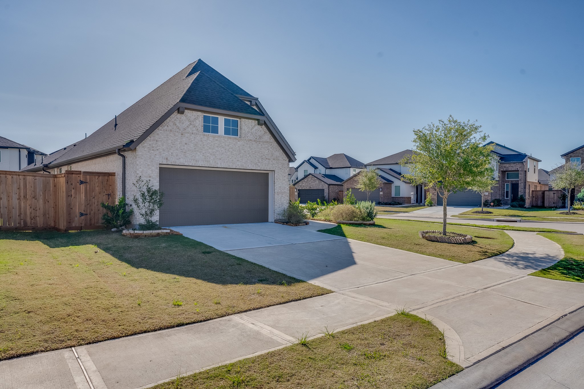 17623 Azalea Clf Court Richmond, TX 77407 - Photo 3 of 33 a front view of a house with a yard and garage
