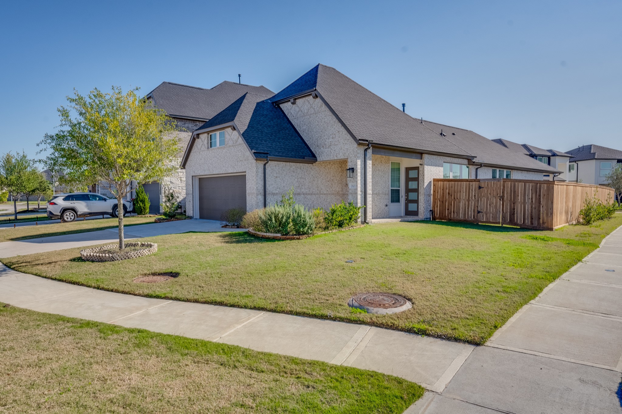 17623 Azalea Clf Court Richmond, TX 77407 - Photo 5 of 33 a view of a house with a big yard plants and large tree