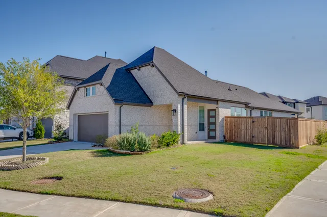 a view of a house with a garden