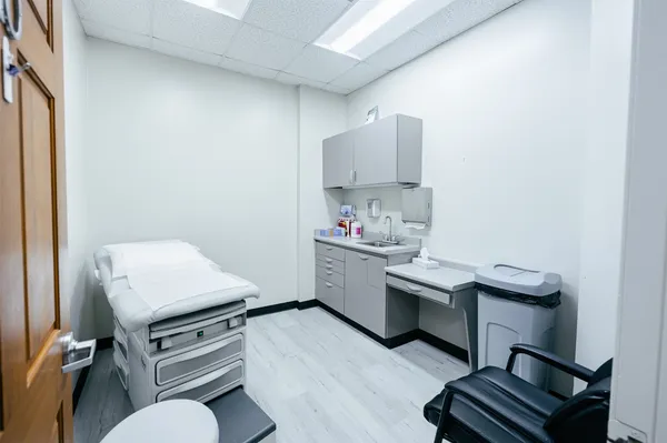 a room with furniture and wooden floor