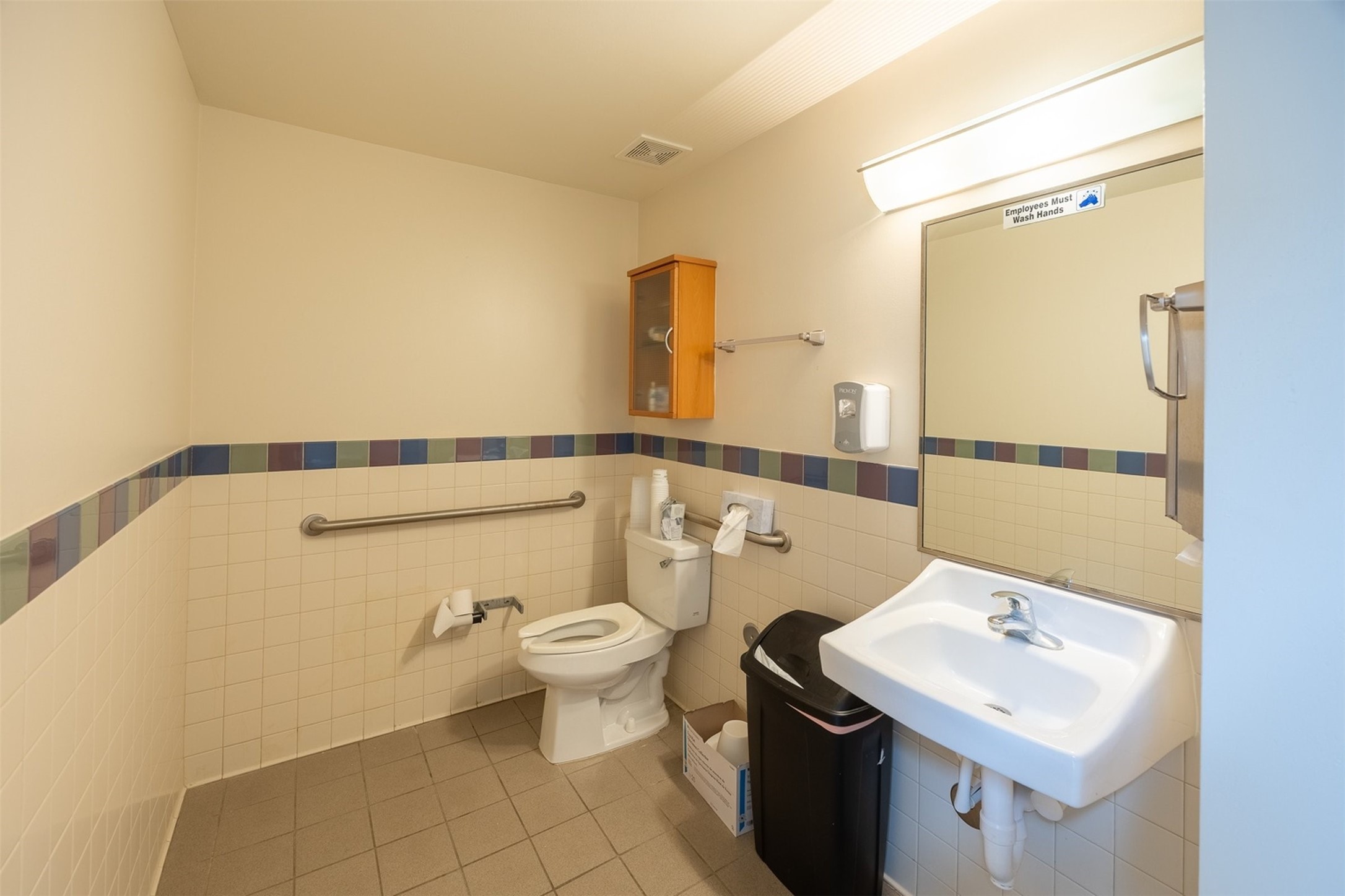 455 School Road, Unit 29 Tomball, TX 77375 - Photo 8 of 12 a bathroom with a sink a toilet and mirror