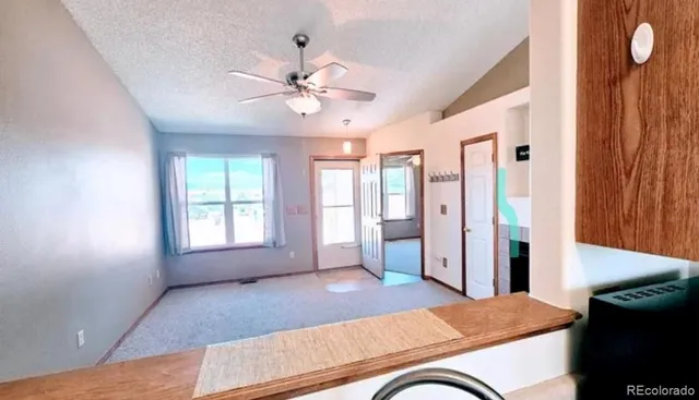 a view of livingroom with furniture window and wooden floor