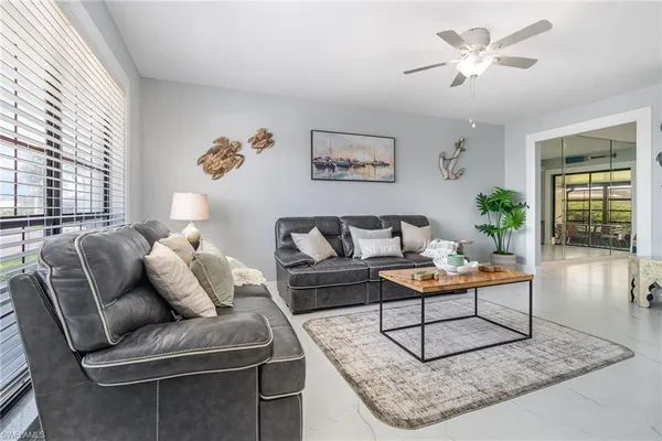 a living room with furniture and a rug