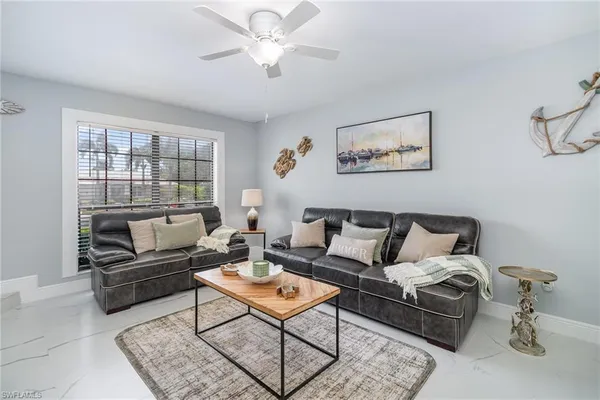a living room with furniture and a window