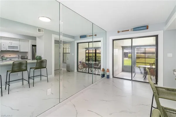 a lobby with furniture and floor to ceiling window