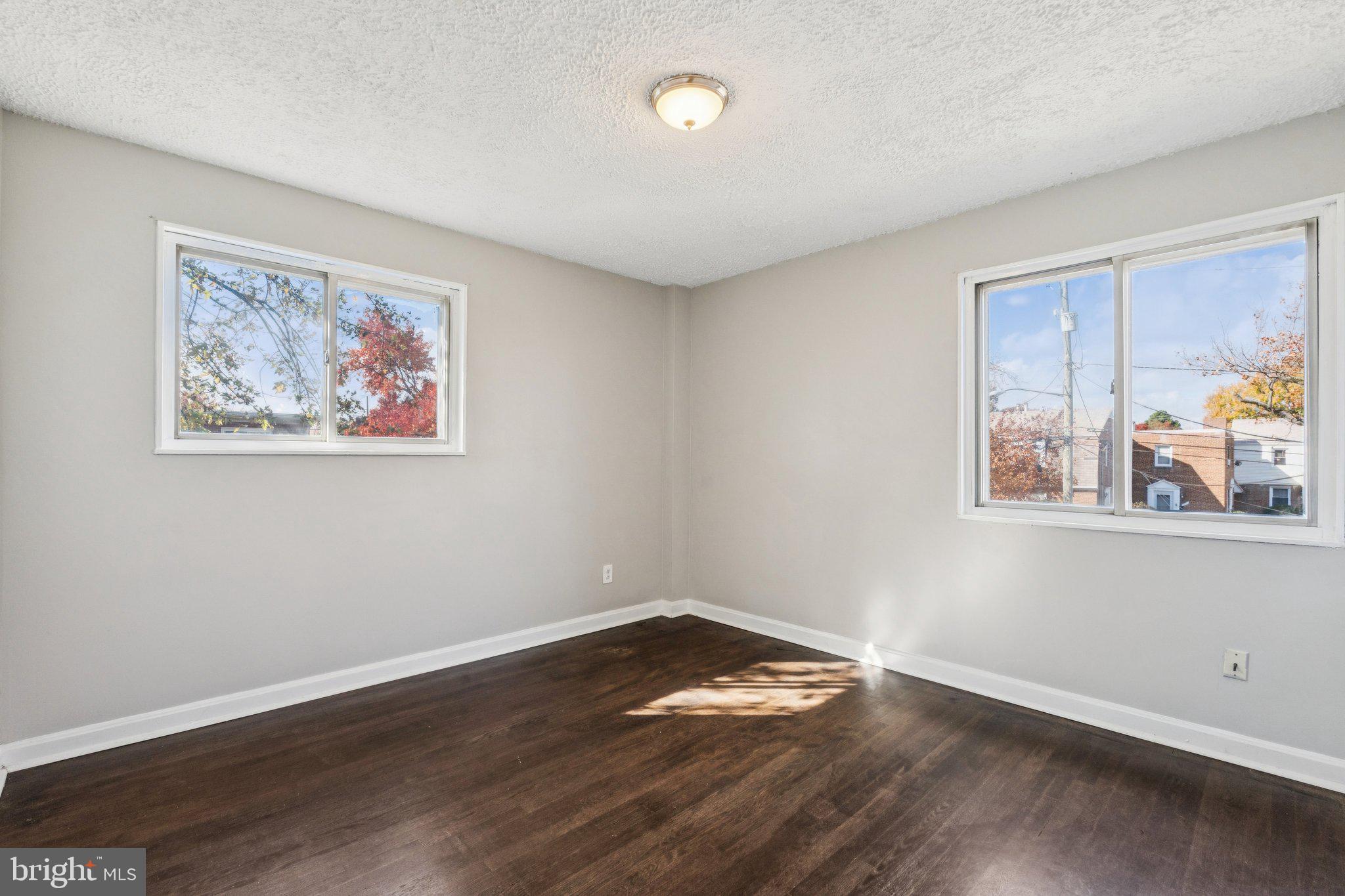 2803 Keating Street Temple Hills, MD 20748 - Photo 9 of 20 a view of empty room with wooden floor and fan