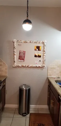 a room with cabinets and dust bin