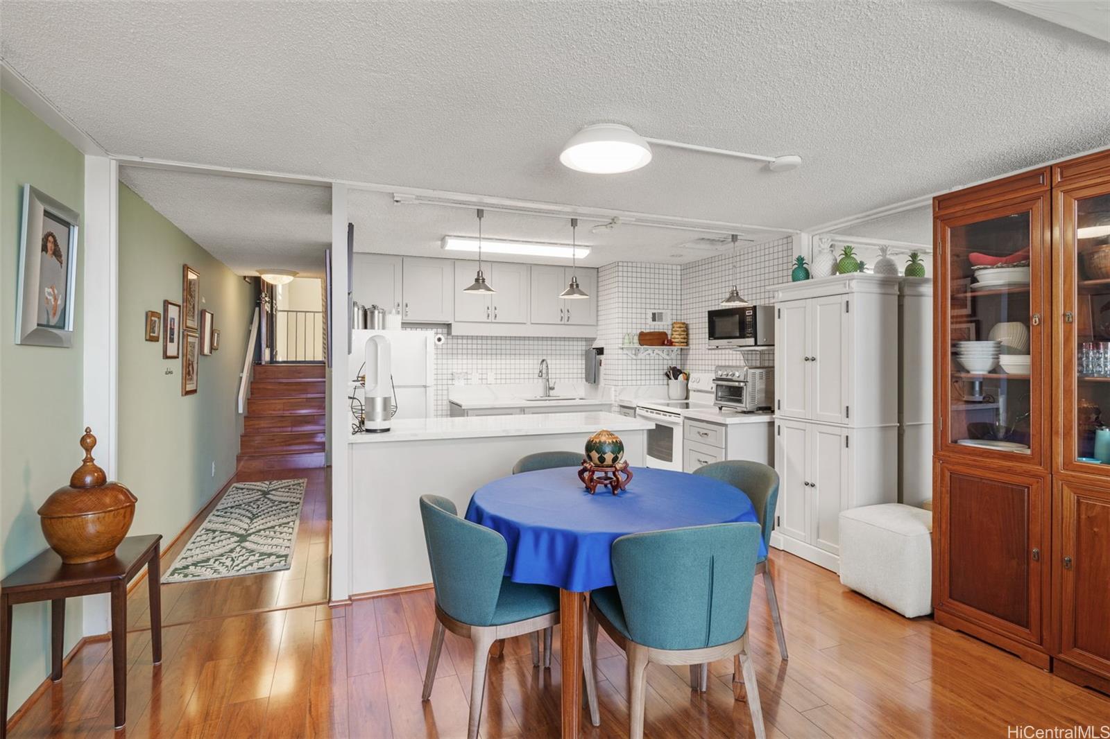 666 Prospect Street, Unit I402 Honolulu, HI 96813 - Photo 3 of 19 a view of a dining room with furniture and wooden floor